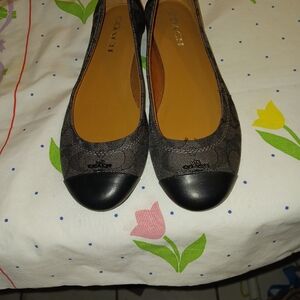 A pair of Coach Flats